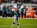 Philadelphia Eagles quarterback Jalen Hurts (1) runs the ball during the first half of an NFL football game against the Chicago Bears in Chicago.