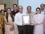 GMC Jammu, principal Dr Ashutosh Gupta (white shirt) and senior faculty members with IIRF Trophy. (HT)