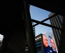 People walk past a television channel advertisement featuring Israeli Prime Minister Benjamin Netanyahu, right, and his main rival, opposition candidate Gadi Eisenkot, ahead of Israel's general election, in Ramat Gan, Israel, Thursday, Sept. 24, 2026.
