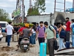 Lovely Professional University (LPU) students, carrying their luggage, prepare to leave for their hometowns, in Phagwara on Monday. 