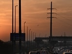 A view of the sunset over the Barapullah flyover, in New Delhi, India.