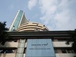 A screen displays a message of the National Stock Exchange (NSE) listing ceremony at the Bombay Stock Exchange (BSE) in Mumbai on September 24