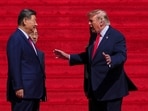President Donald Trump, right, speaks with China's President Xi Jinping on the steps of the National Archives Museum, Friday, Sept. 25, 2026, in Washington. 