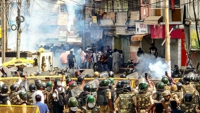 Security personnel disperse protesters by firing tear gas shells following stone-pelting incidents during a protest against the proposed removal of a portion of the 'Shahi Masjid' for road widening, in Ujjain (ANI) Security personnel disperse protesters by firing tear gas shells following stone-pelting incidents during a protest against the proposed removal of a portion of the 'Shahi Masjid' for road widening, in Ujjain (ANI)