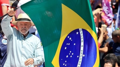 Brazil's President and presidential candidate Luiz Inacio Lula da Silva waves a national flag during a campaign rally in Sao Paulo, Brazil, on September 26, 2026. (AFP)
