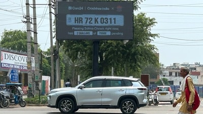 Gurugram Traffic Police installed a digital display board at Sohna Chowk to help motorists check their e-challans, PUC certificates, and vehicle insurance status near Jail Chowk, 01 August 2026. (Photo by Parveen Kumar/Hindustan Times)