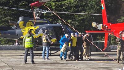 Trekkers, porters landed at Harshil helipad after their evacuation from higher reaches in Uttarkashi district. (HT Photo) Trekkers, porters landed at Harshil helipad after their evacuation from higher reaches in Uttarkashi district. (HT Photo)