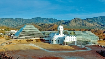 Biosphere 2, sealed in 1991, experienced oxygen depletion attributed to microbes and concrete reactions. Studies indicated that respiratory processes exceeded plant oxygen production, revealing complexities in closed ecosystems and the significant role of the building itself in atmospheric changes. (Adobe Stock) Biosphere 2, sealed in 1991, experienced oxygen depletion attributed to microbes and concrete reactions. Studies indicated that respiratory processes exceeded plant oxygen production, revealing complexities in closed ecosystems and the significant role of the building itself in atmospheric changes. (Adobe Stock)