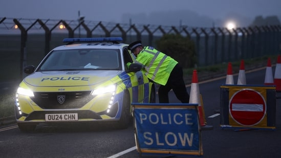 Armed guards continued to maintain a cordon around a nearby village, and police patrolled around the airfield.