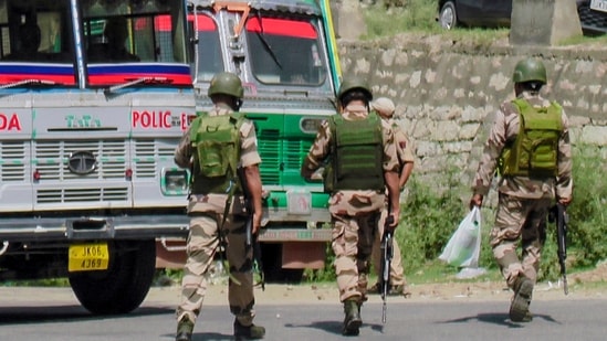 CISF and Jammu & Kashmir Police conduct checking and surveillance at a transit checkpoint.