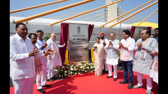 Home minister Amit Shah, chief minister Rekha Gupta, public works department minister Parvesh Verma, minister of state for road transport and highways Harsh Malhotra, and other cabinet ministers were present at the event. (HT Photo)