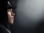Aaron Judge #99 of the New York Yankees looks on from the dugout.