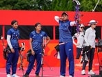 Jyothi Surekha Vennam, center, of India lines up a shot during the compound women's team archery semifinal between South Korea and India