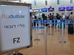Passengers queue at the flydubai counters in Ben Gurion Airport near Tel Aviv. 