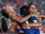 India's Prachi, India's Kiran and India's Poovamma Machettira celebrate winning the women's 4x400m relay final during the 2026 Asian Games. (AFP)