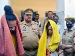 Police take away Merchant Navy officer Saurabh Rajput's wife Muskan and her lover Sahil Shukla after they were arrested in connection with his murder.