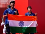 India's Sahil Jadhav, left, and Chikitha Taniparthi celebrate after winning the compound mixed team archery gold medal match against Korea during the 20th Asian Games