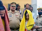 Police take away Merchant Navy officer Saurabh Rajput’s wife Muskan and her lover Sahil Shukla after they were arrested in connection with his murder. (PTI file Photo)