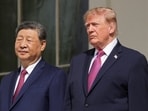 US President Donald Trump and Chinese President Xi Jinping watch a military demonstration from a balcony of the White House in Washington on September 24. 