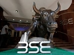 File photo: The Bombay Stock Exchange logo is seen under a bull statue at the entrance of their building in Mumbai
