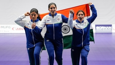 From left, India's Manisha Keer, Ashima Ahlawat and Neeru Dhanda pose with the national flag after winning the silver medal during the victory ceremony for the women's trap shooting team event at the 20th Asian Games 2026 (PTI)