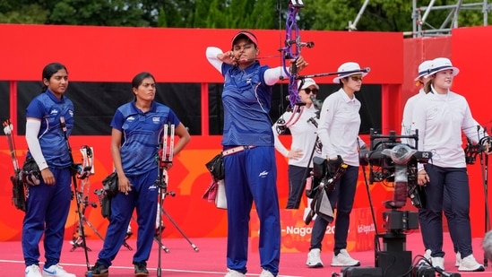 Jyothi Surekha Vennam, center, of India lines up a shot during the compound women's team archery semifinal between South Korea and India (AP Photo/Eugene Hoshiko)