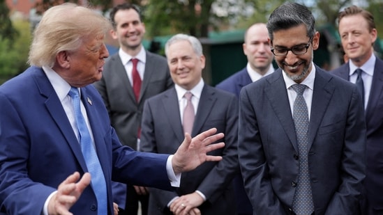 Google CEO Sundar Pichai reacts as US President Donald Trump speaks at the White House driveway following a luncheon in the East Room, in Washington, D.C. (REUTERS)