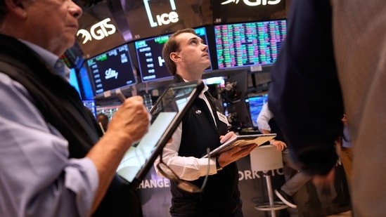 US stocks rise as cooler inflation data eases pressure on the Dow, S&P 500 and Nasdaq. (AP Photo/Seth Wenig)