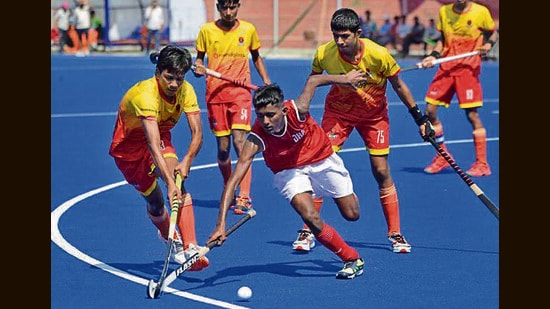 Players in action during a hockey match. (Gurpreet Singh/Hindustan Times)