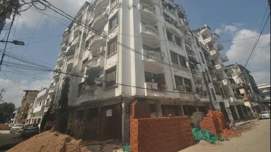 The building, SA Apartment in Ch Barood Khana, came under the spotlight on Monday after a pillar developed cracks, leaving the structure at risk and forcing 25 families to move out. (File Photo)