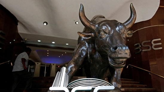 File photo: The Bombay Stock Exchange logo is seen under a bull statue at the entrance of their building in Mumbai