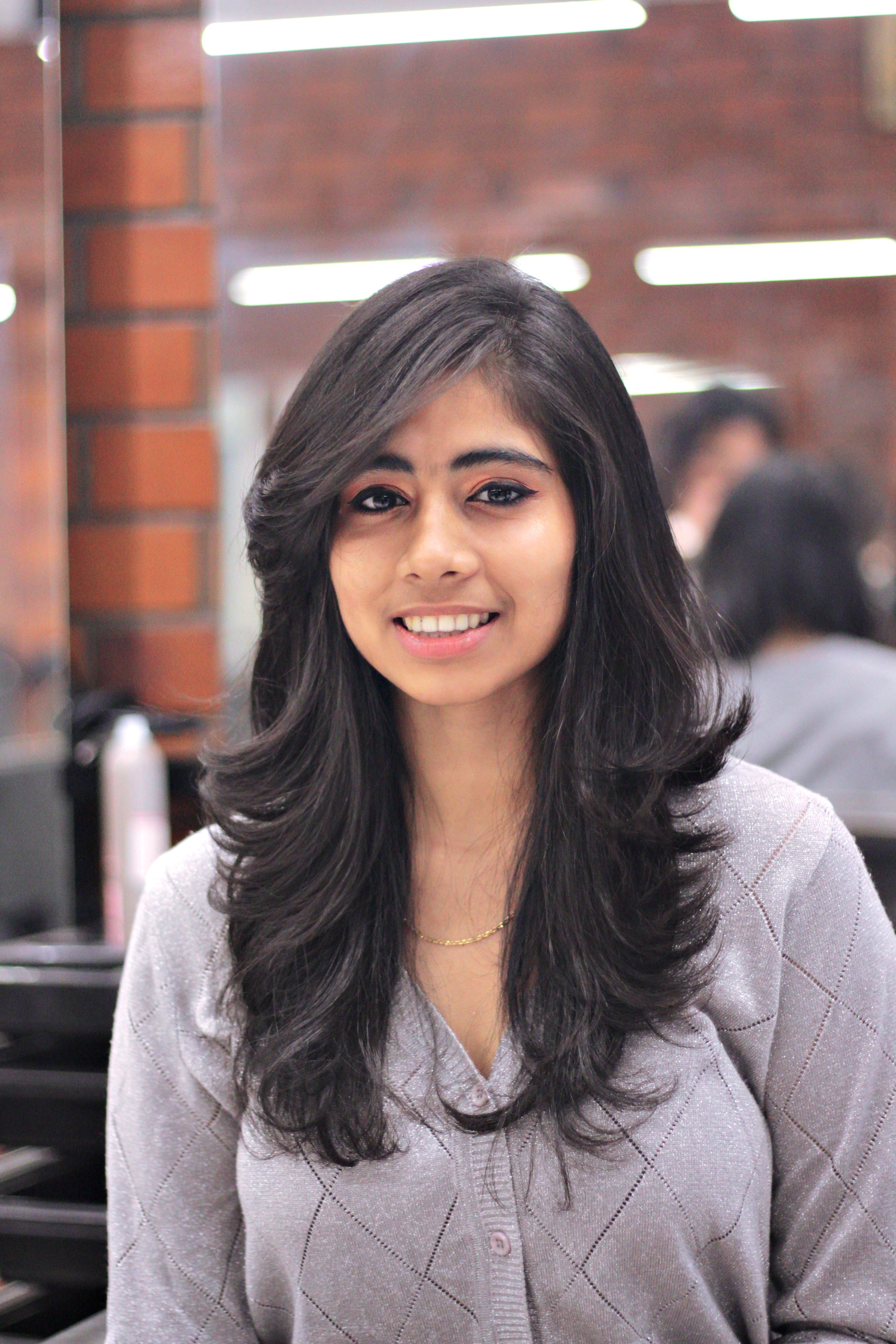 With long hair, maintenance and precision are usually less of a concern, unless you want to shape your layers. (Pexel)