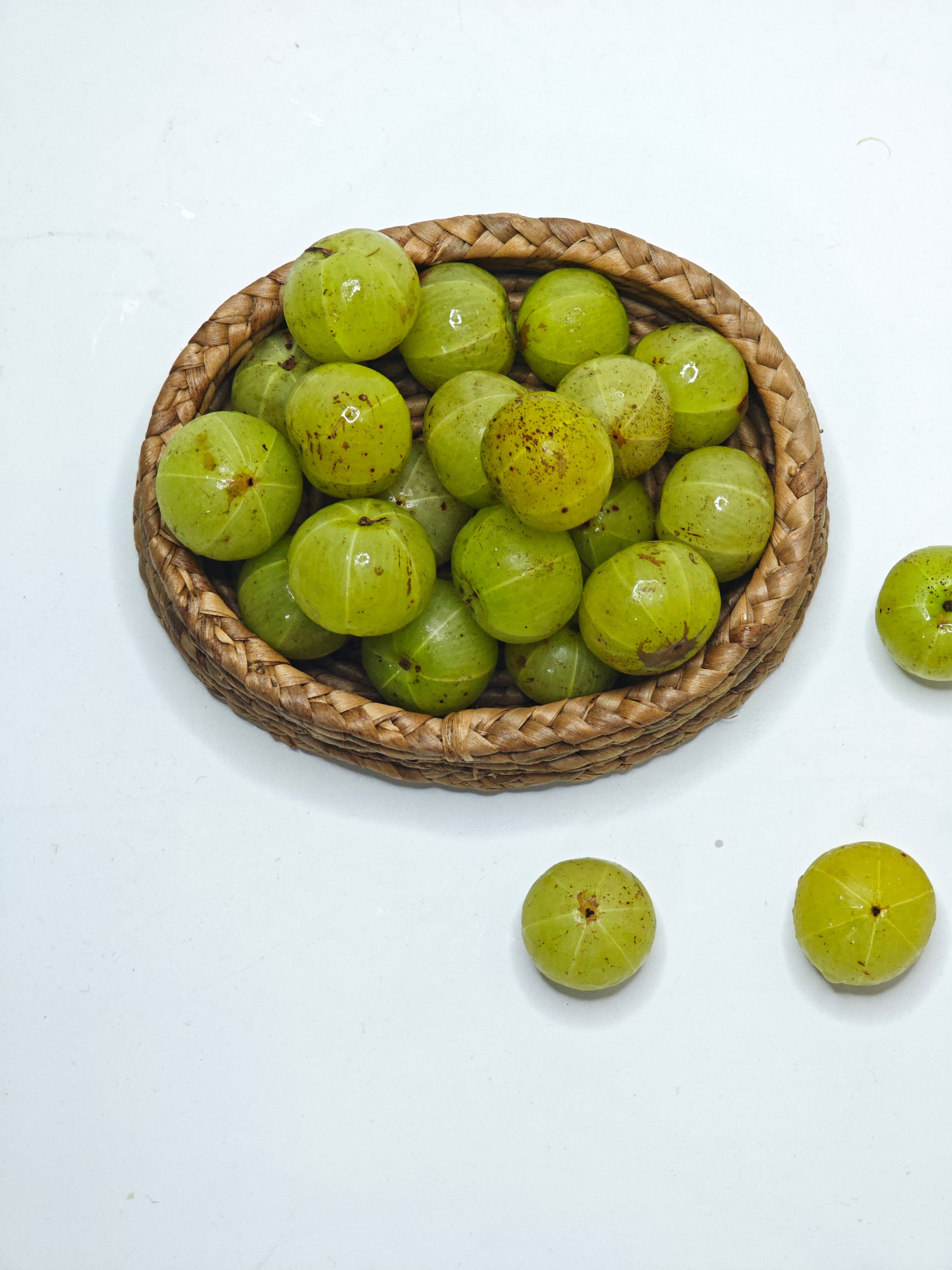 Amla is intensely sour, and on a genuinely empty stomach a meaningful minority of people get acidity, a burning sensation, or nausea. (Pexel) Amla is intensely sour, and on a genuinely empty stomach a meaningful minority of people get acidity, a burning sensation, or nausea. (Pexel)