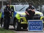 Police officers guard an area as roadblocks remain in place near RAF Fairford airbase.