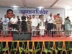 Chandigarh administrator Gulab Chand Kataria launching the online property services during the Samaadhaan Shivir held at the Community Centre in Ram Darbar, Chandigarh, on Wednesday. (HT)
