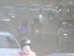 Commuters make their way through a haze-covered and dusty stretch of road as air pollution levels rise in the national capital in New Delhi, India, on September 22, 2026 (HT Photo/Sanchit Khanna)