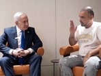 Israeli Prime Minister Benjamin Netanyahu meets Yaniv Hayun, a passenger on the FlyDubai flight bound for Israel from the United Arab Emirates, which was diverted to Saudi Arabia following an emergency signal