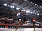 India's Vithya Ramraj celebrates as she crosses the finish line to win the women's 4 x 400m Relay Final. (REUTERS)