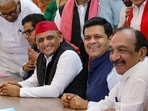 Samajwadi Party (SP) President Akhilesh Yadav flanked by party candidates Professor Ram Gopal Yadav, second left, and Dhanraj Parimal Nathwani, second right.