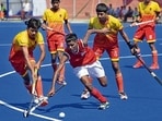 Players in action during a hockey match. (Gurpreet Singh/Hindustan Times)