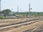 The current state of the landfill, as seen on Wednesday, where all bamboo saplings (below) planted last March died out, ending the plan to create a green zone at the landfill. (Vipin Kumar/HT PHOTO)
