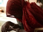 The woman alleged that a group of villagers barged into her house when her husband and son were not at home.