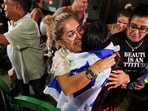 Passengers who were on the FlyDubai aircraft bound for Israel from the United Arab Emirates, which was diverted to Saudi Arabia following an emergency signal, are greeted by their friends and family, as they arrive at the Ben Gurion International Airport, in Lod, near Tel Aviv, Israel.(Reuters)