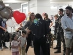 Passengers who experienced an emergency landing in Saudi Arabia, during a flight on FlyDubai plane, arrive at Ben Gurion International Airport, near Tel Aviv, Israel, on Wednesday.