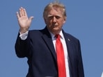 Donald Trump waves while boarding Air Force One, as he travels to Texas and Oklahoma, at Joint Base Andrews, Maryland, US, October 1.