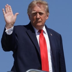 Donald Trump waves while boarding Air Force One, as he travels to Texas and Oklahoma, at Joint Base Andrews, Maryland, US, October 1.