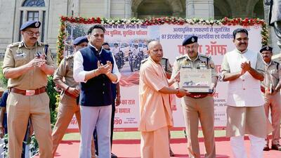 Chief minister Yogi Adityanath receives a memento from director general of police Rajeev Krishna during the flagging off of interceptor vehicles (four-wheelers and two-wheelers) equipped with state-of-the-art equipment, in Lucknow on Thursday. (ANI PHOTO)