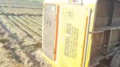 The bus that overturned into a field near Muradpur village in Hoshiarpur district on Thursday.
