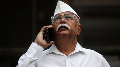 A man looks at a screen outside the Bombay Stock Exchange (BSE) building in Mumbai (Reuters File)