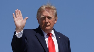 Donald Trump waves while boarding Air Force One, as he travels to Texas and Oklahoma, at Joint Base Andrews, Maryland, US, October 1. (REUTERS)